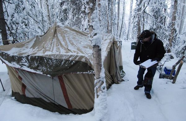 Tent and man in snow
