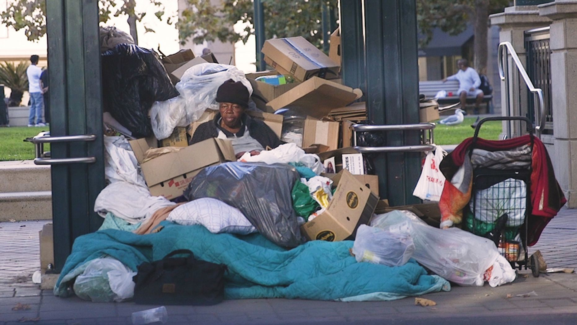 Homeless Woman sleeps in trash pile Oakland